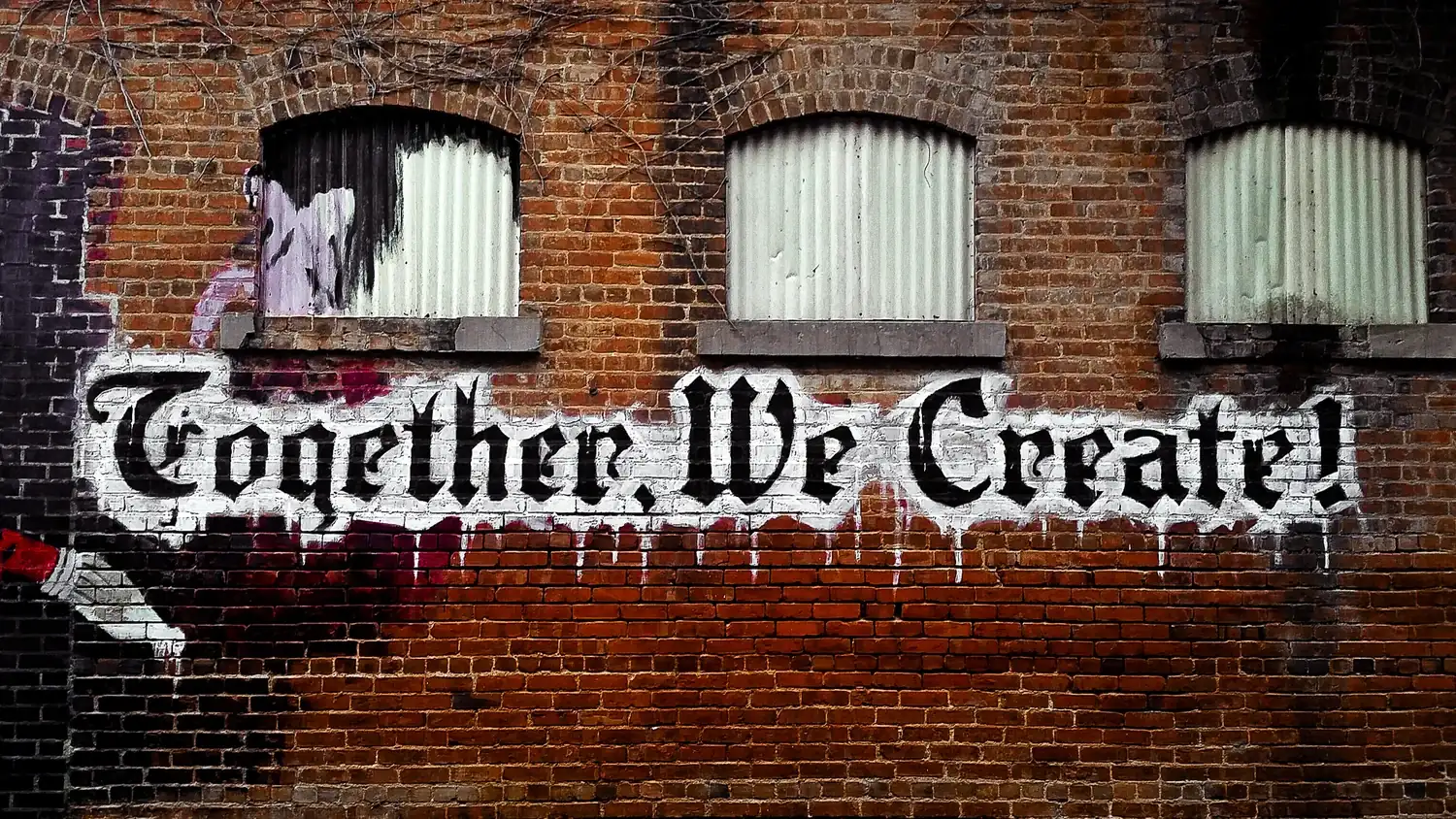 Together, We Create mural painted on the brick wall at Sound & Fury Print Shop in Warrenville, IL